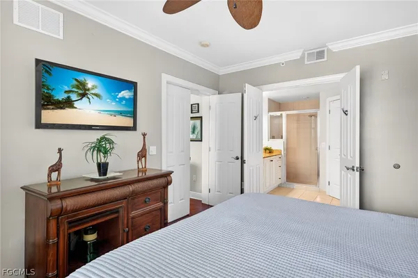 a bedroom with a bed and a lamp on table