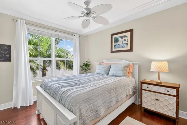 a bathroom with a granite countertop sink toilet mirror and shower
