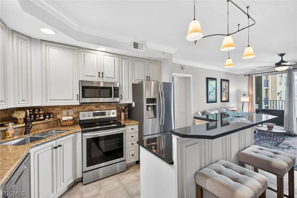 a view of a dining room with furniture and a mirror