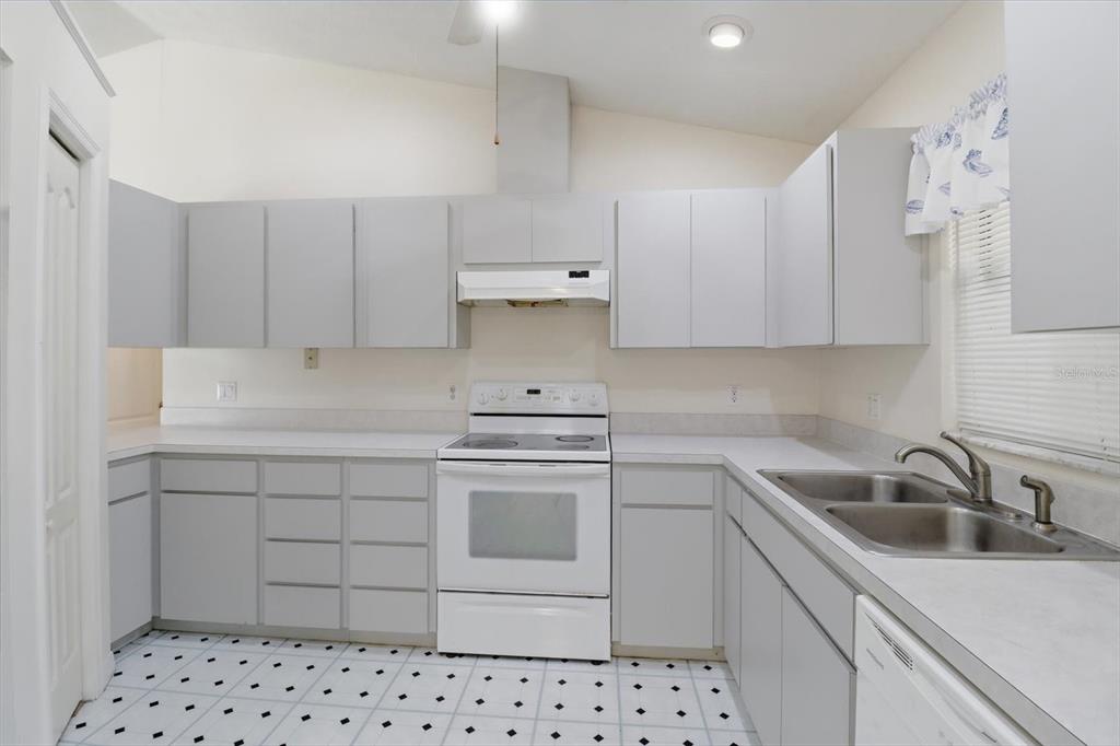 6355 East Rush Street Inverness, FL 34452 - Photo 8 of 27 a kitchen with a sink stove and cabinets