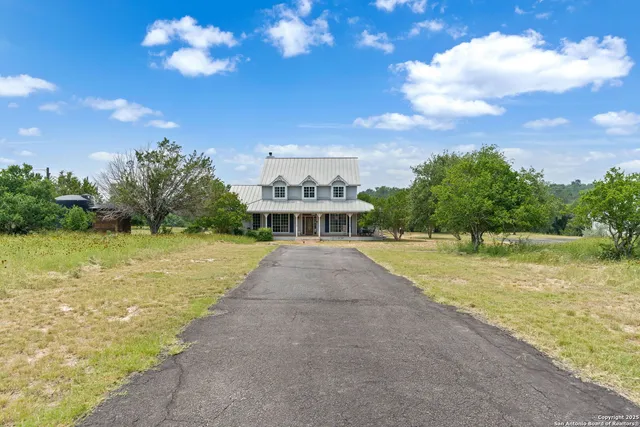 a view of a swimming pool with a yard
