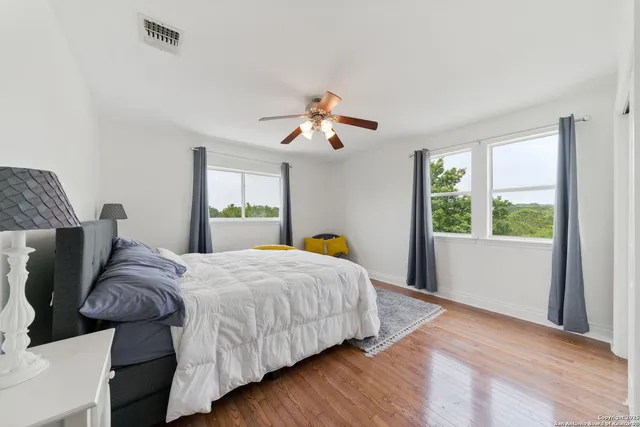 a bedroom with bed and window