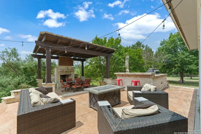 a patio view with a table and chairs