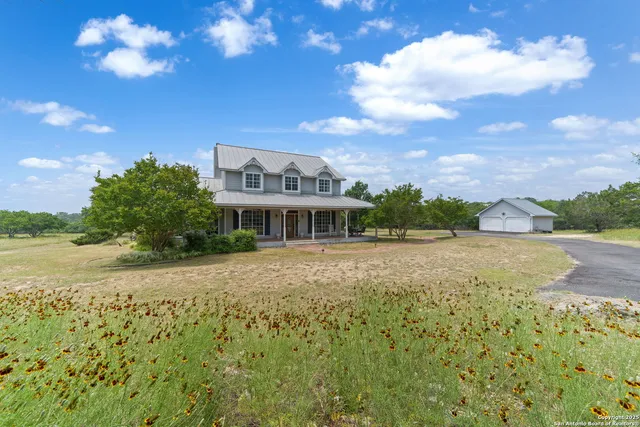 a view of a house with a big yard