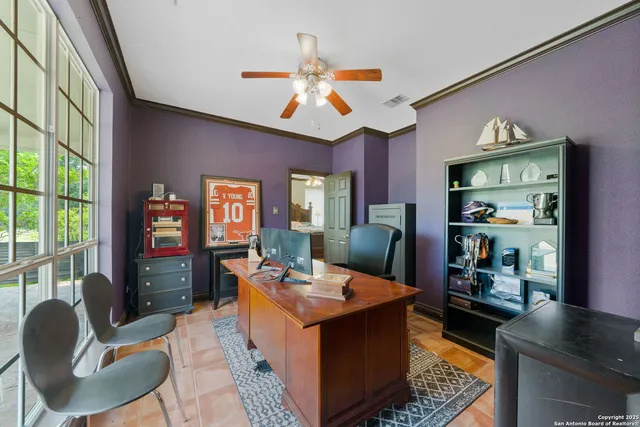 a living room with fireplace furniture and a flat screen tv