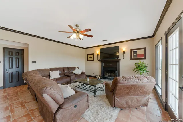 a living room with furniture wooden floor and a fireplace