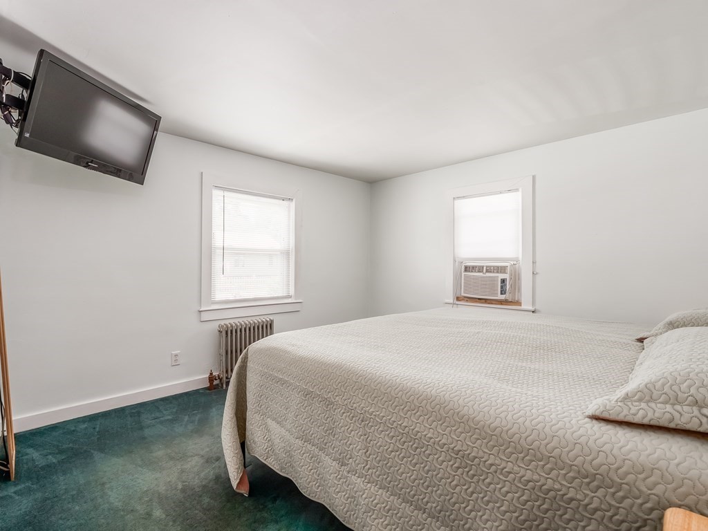 20 Rangeway Road Billerica, MA 01862 - Photo 21 of 41 a bedroom with a bed tv and window