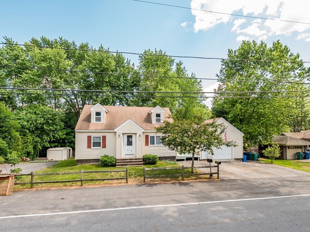 20 Rangeway Road Billerica, MA 01862 - Photo 41 of 41 a front view of a house with a garden and outdoor seating