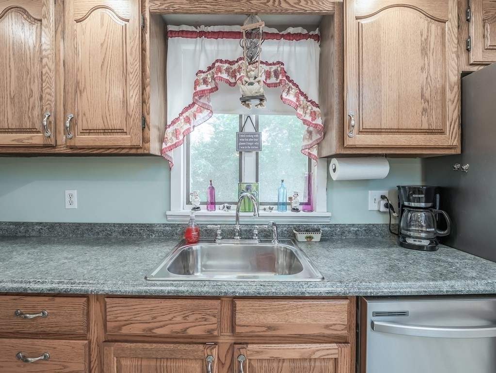 20 Rangeway Road Billerica, MA 01862 - Photo 9 of 41 a kitchen with granite countertop a sink and cabinets