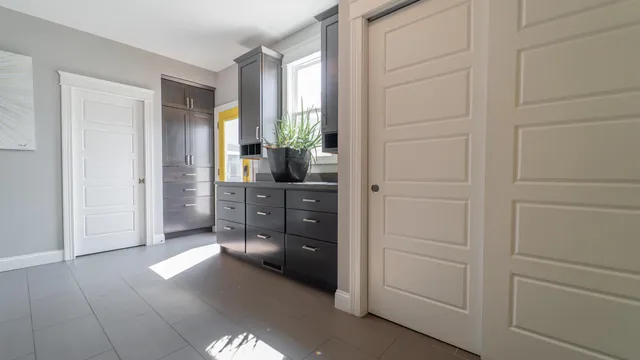 a bathroom with a double vanity sink and mirror