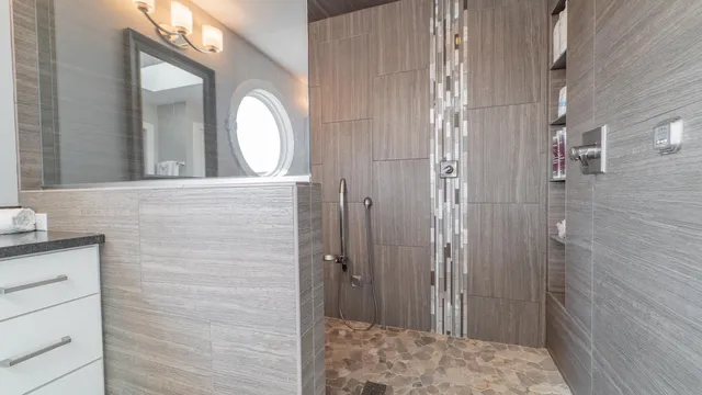 a bathroom with a granite countertop toilet a sink and a mirror