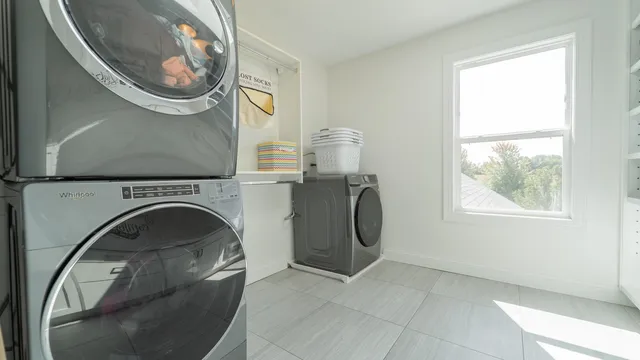 a bedroom with a bed and a chair