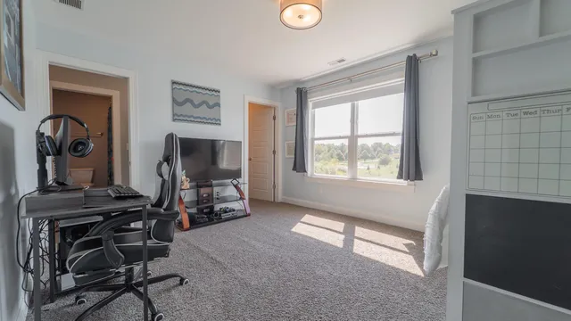 a view of hallway with stairs and furniture
