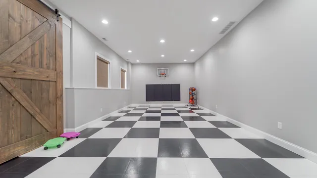 a front view of a house with a yard and a garage