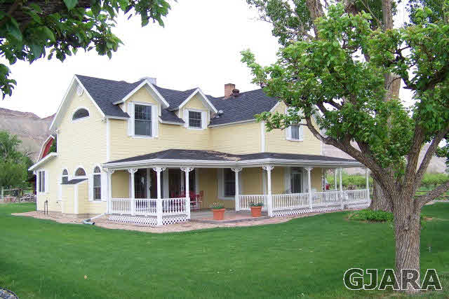 3530 G Road Palisade, CO 81526 - Photo 1 of 25 a front view of a house with a garden