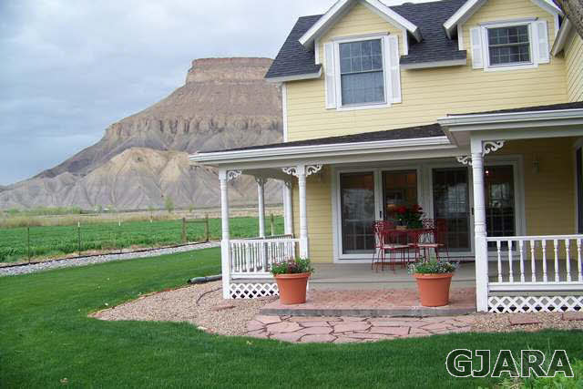 3530 G Road Palisade, CO 81526 - Photo 22 of 25 front view of a house with a yard