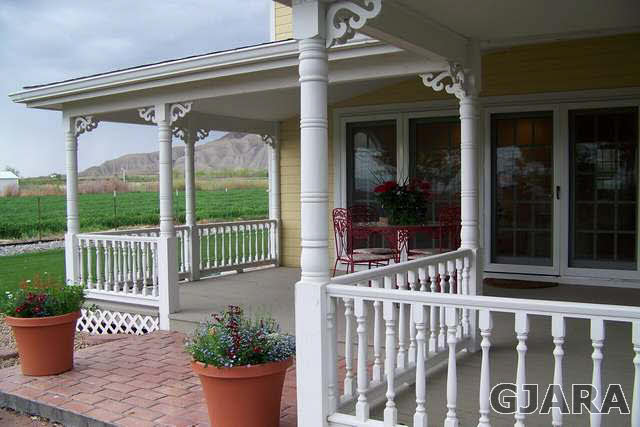 3530 G Road Palisade, CO 81526 - Photo 23 of 25 a view of a balcony with chair and potted plants