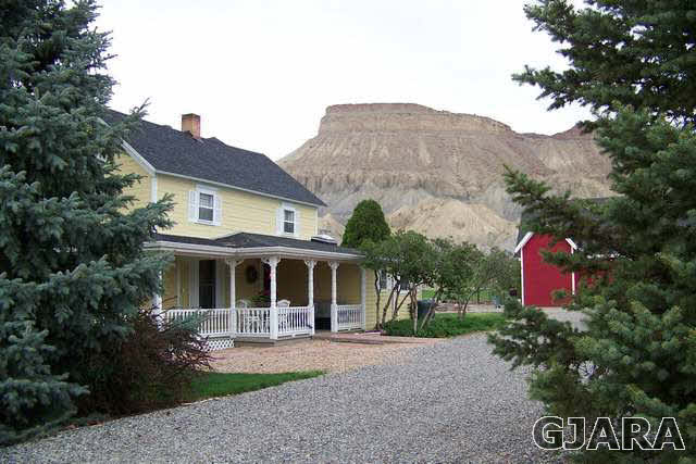 3530 G Road Palisade, CO 81526 - Photo 24 of 25 a front view of house with yard and trees around