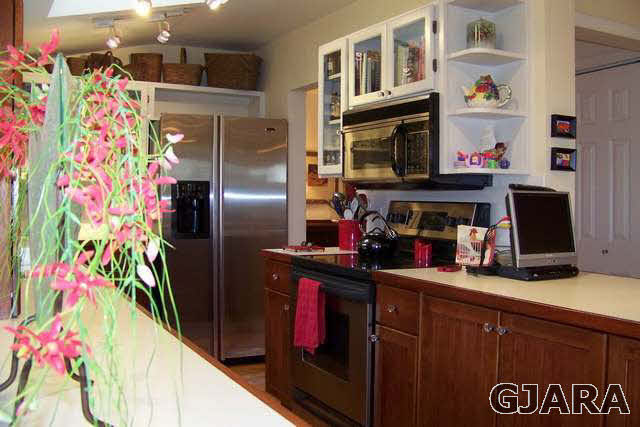 3530 G Road Palisade, CO 81526 - Photo 9 of 25 a kitchen with stainless steel appliances granite countertop a refrigerator and a sink