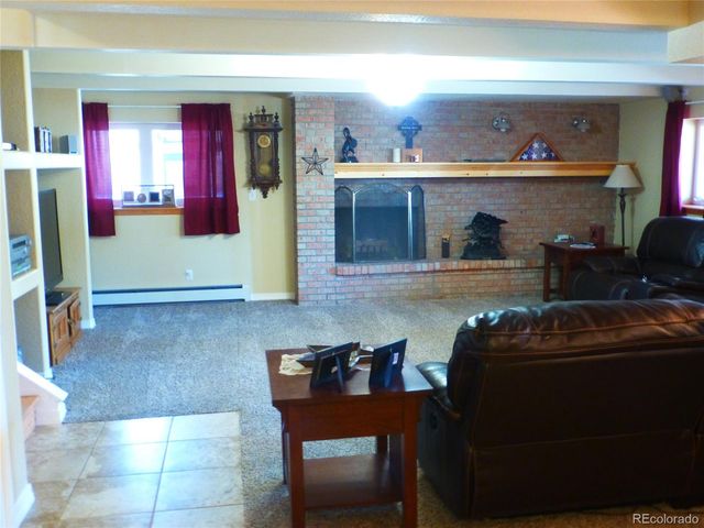 a white toilet sitting next to a white sink and a mirror