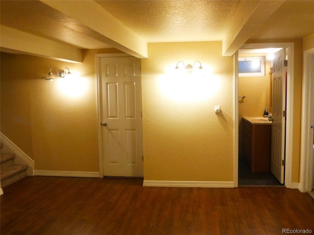 a bedroom with a bed and a television