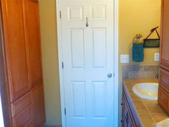 a bathroom with a toilet and a bathtub