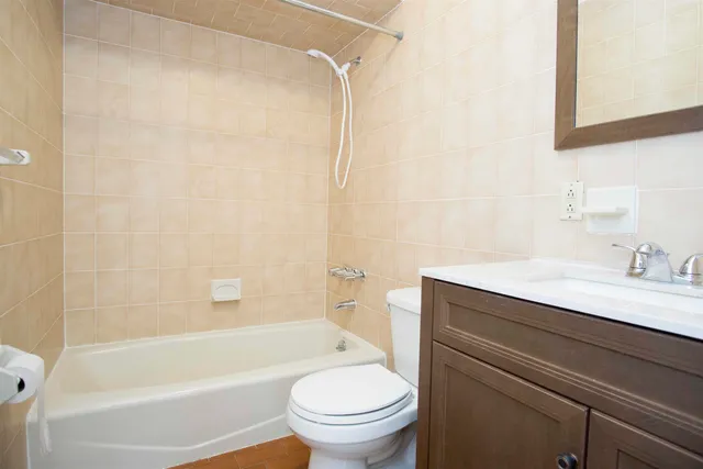 a bathroom with a sink a toilet and a bathtub