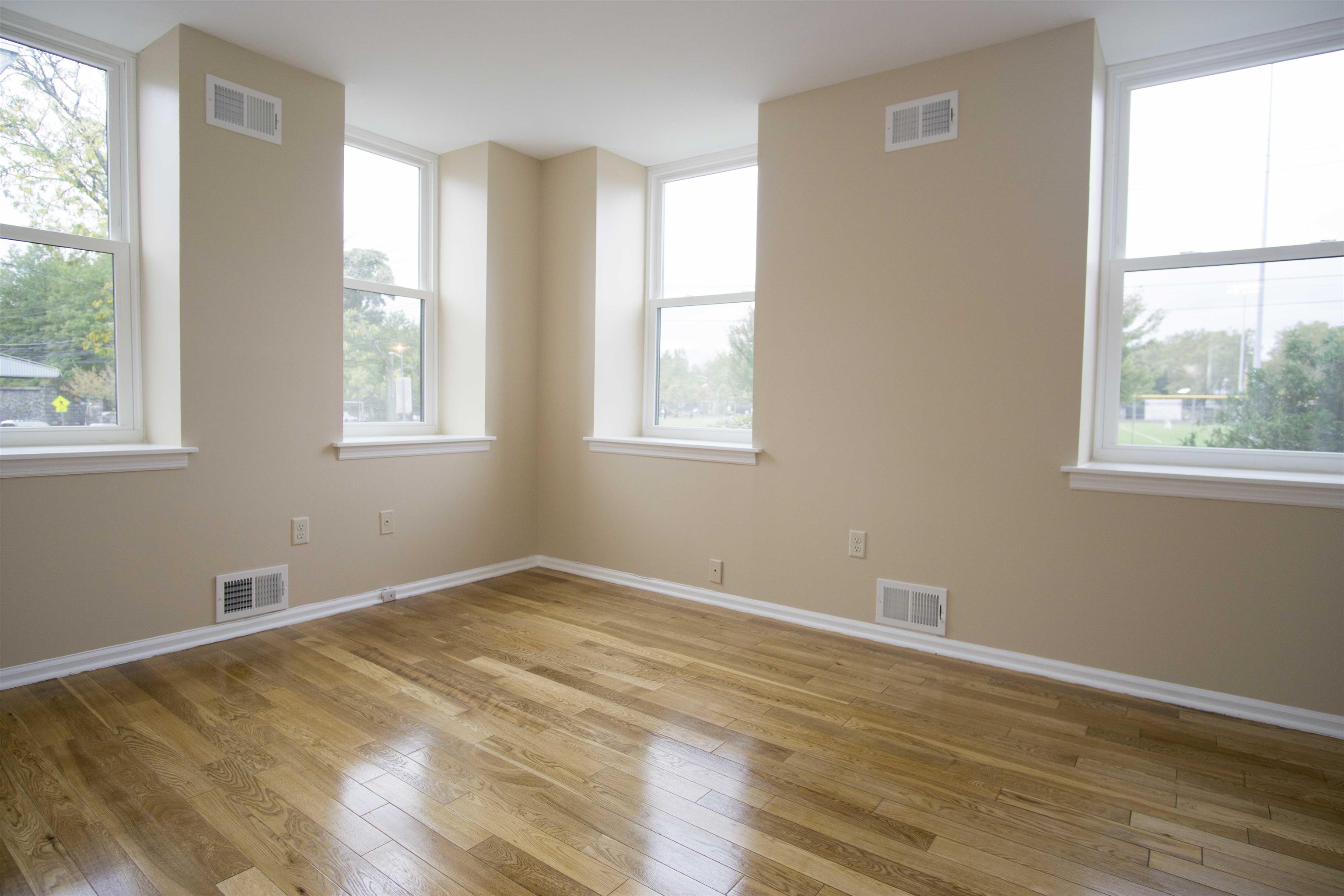 200 Central Avenue, Unit B5 Jersey City, NJ 07307 - Photo 10 of 12 a view of an empty room with wooden floor and a window