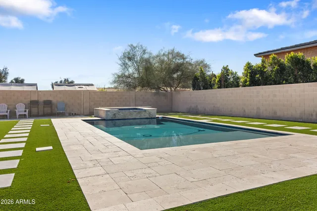 a view of swimming pool with a yard