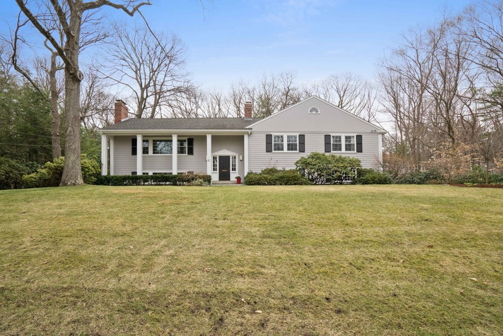 51 Baskin Road Lexington, MA 02421 - Photo 1 of 28 a front view of a house with a garden