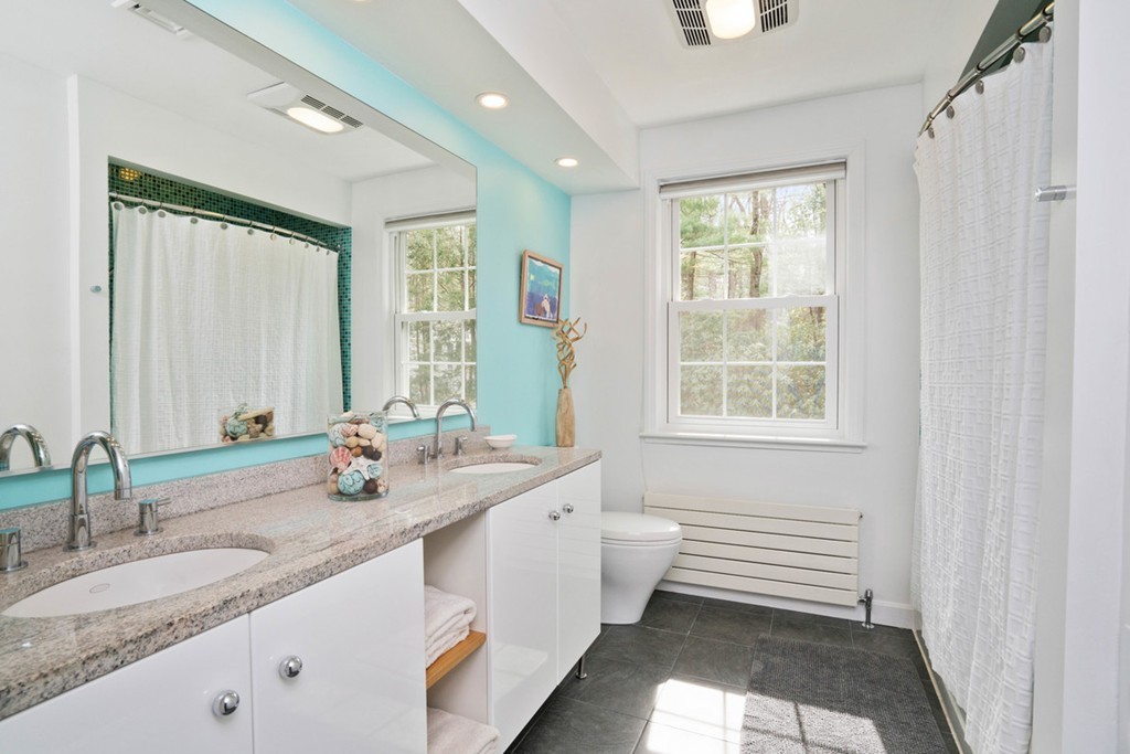 51 Baskin Road Lexington, MA 02421 - Photo 15 of 28 a bathroom with a granite countertop sink and a large mirror