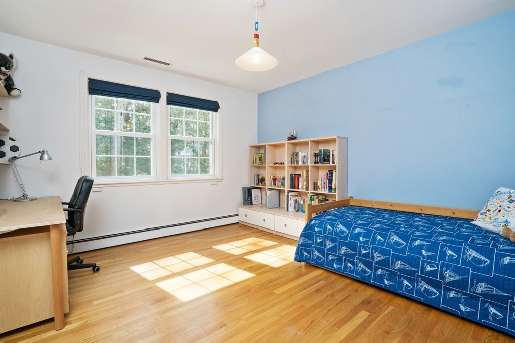 51 Baskin Road Lexington, MA 02421 - Photo 16 of 28 a bedroom with bed and window