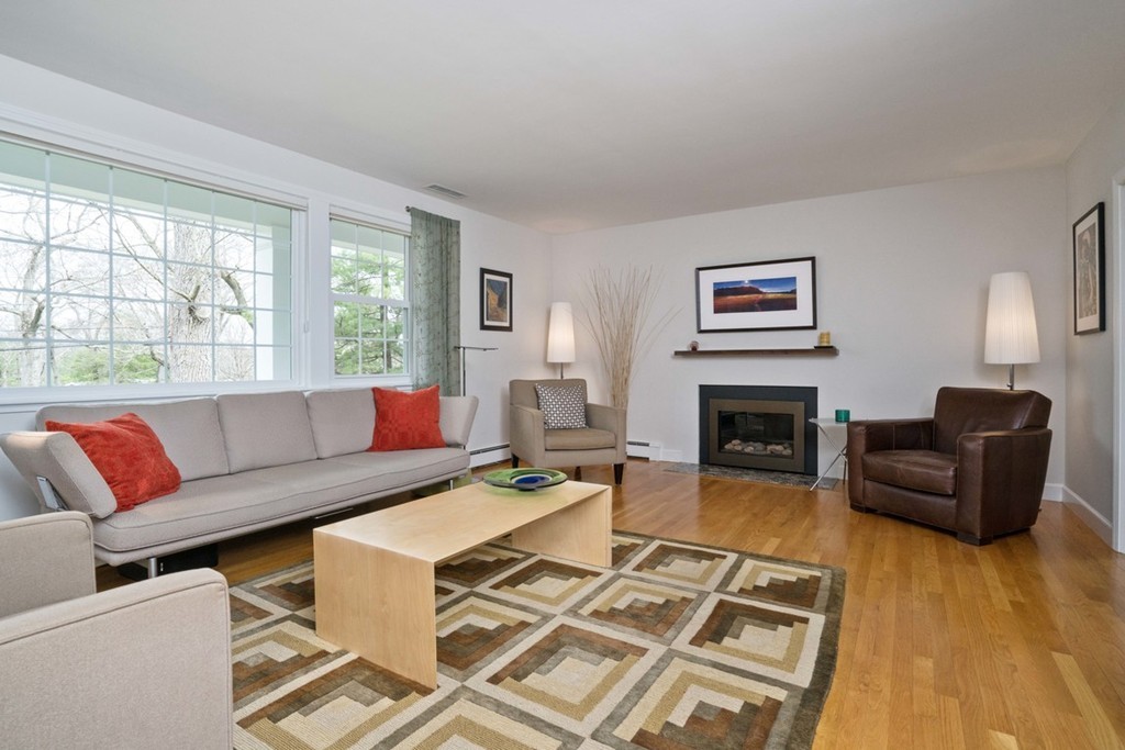 51 Baskin Road Lexington, MA 02421 - Photo 2 of 28 a living room with furniture and a fireplace