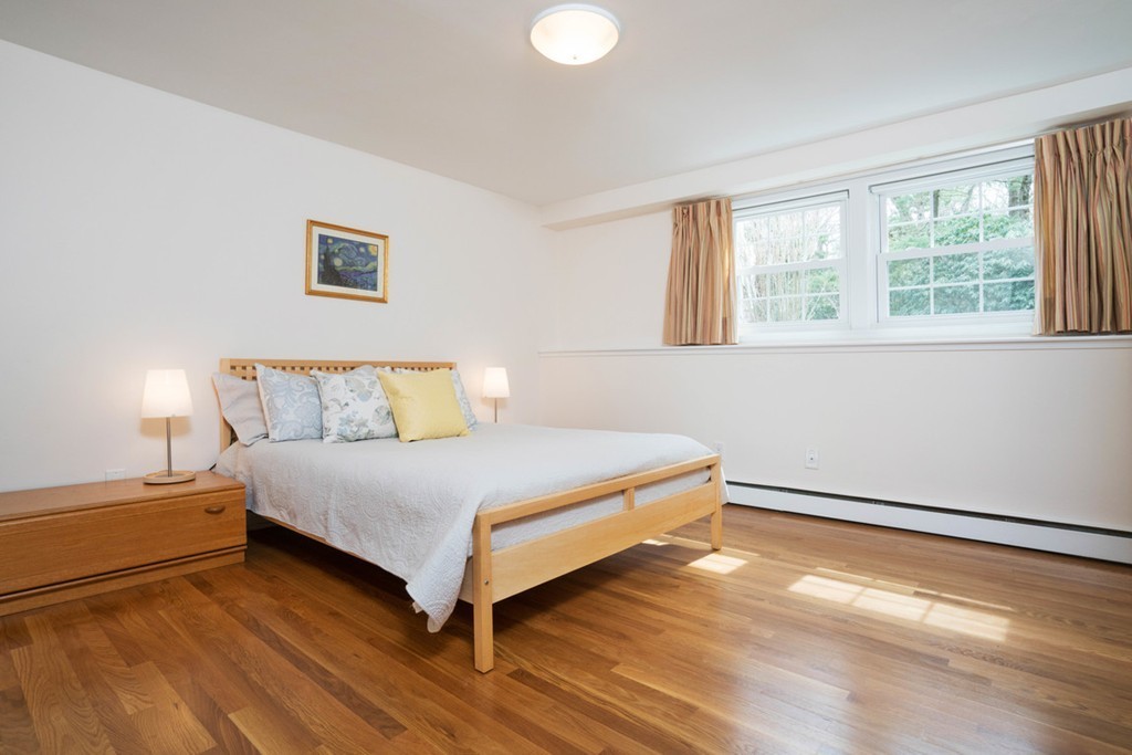 51 Baskin Road Lexington, MA 02421 - Photo 22 of 28 a bedroom with a bed and a window
