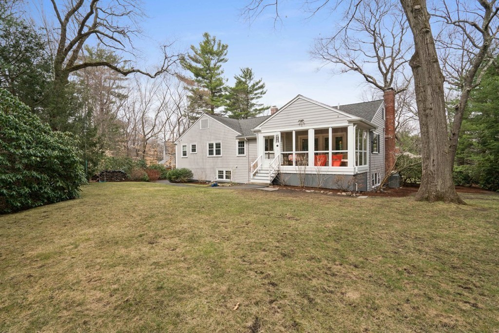 51 Baskin Road Lexington, MA 02421 - Photo 25 of 28 a front view of a house with a yard
