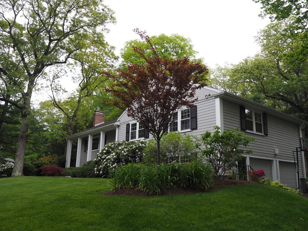 51 Baskin Road Lexington, MA 02421 - Photo 28 of 28 a front view of a house with a garden