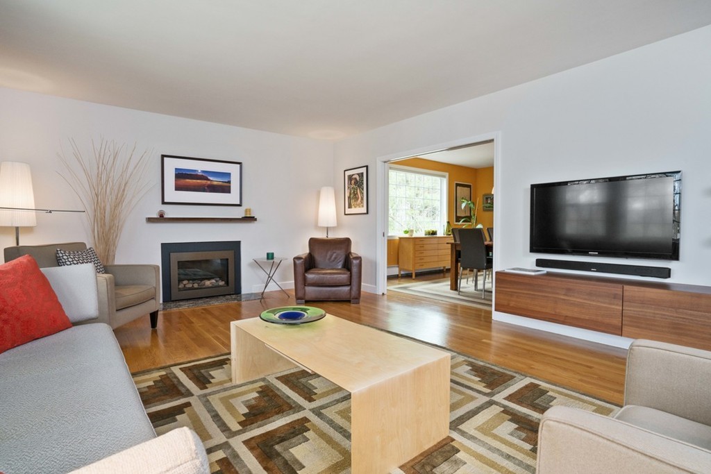 51 Baskin Road Lexington, MA 02421 - Photo 3 of 28 a living room with furniture and a flat screen tv
