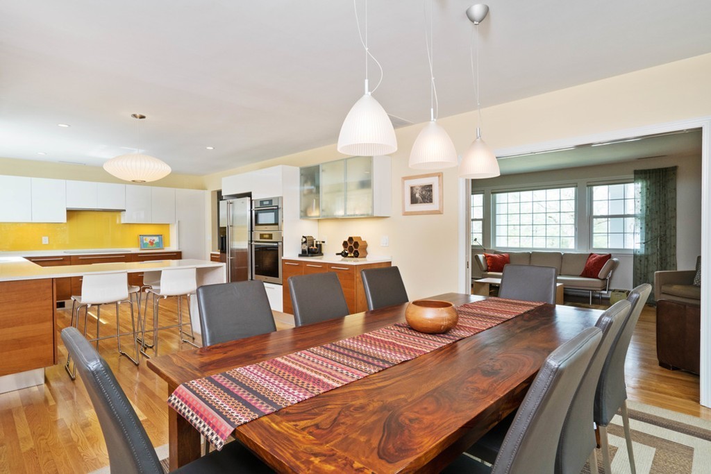 51 Baskin Road Lexington, MA 02421 - Photo 7 of 28 a open dining room with furniture a window and wooden floor