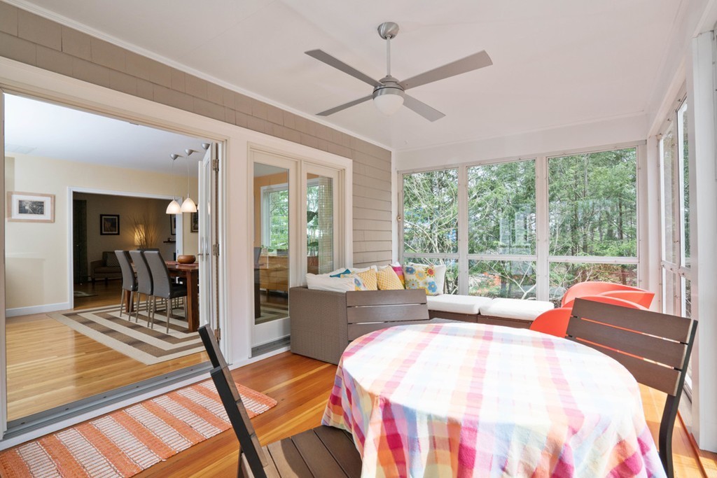 51 Baskin Road Lexington, MA 02421 - Photo 8 of 28 a living room with furniture and a large window