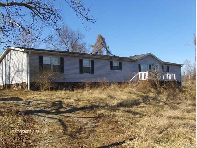 29 Charlie Winstead Road Roxboro, NC 27574 - Photo 1 of 4 a front view of a house with a yard