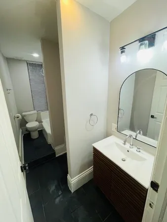 a bathroom with a sink and mirror