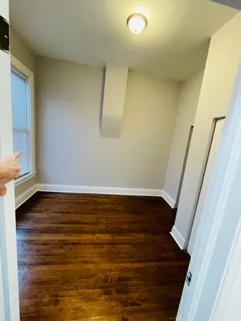 a view of small space with wooden floor