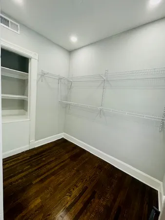 a view of an empty walk in closet