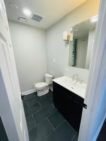 a bathroom with a sink and a toilet