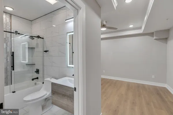 a bathroom with a shower toilet sink and bathtub