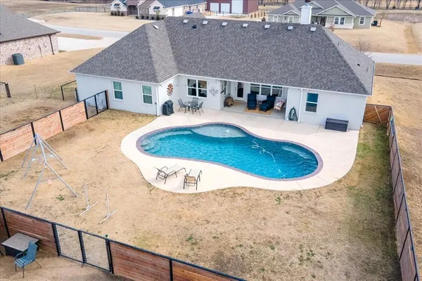 a view of a swimming pool with a lounge chair