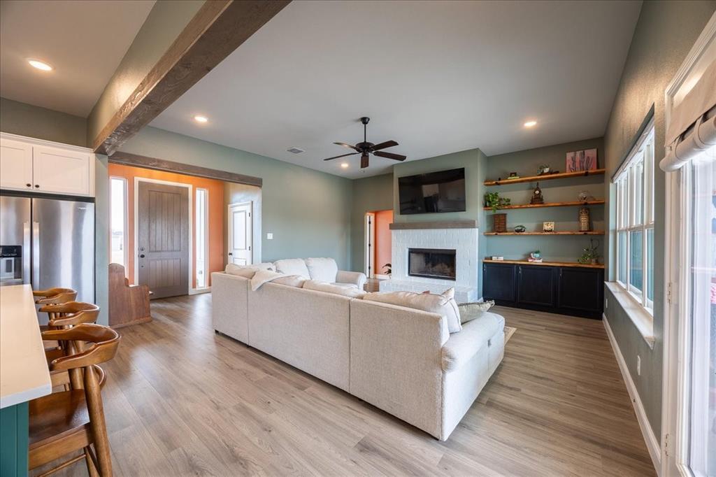 10251 Finch Road Sanger, TX 76266 - Photo 5 of 38 Living area with wood burning brick fire place