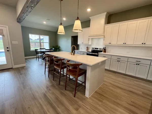 a living room with fireplace furniture and a flat screen tv