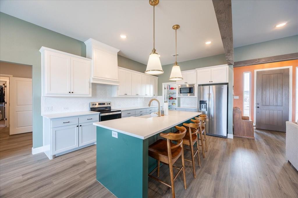 10251 Finch Road Sanger, TX 76266 - Photo 7 of 38 Great flow from the kitchen to the living area