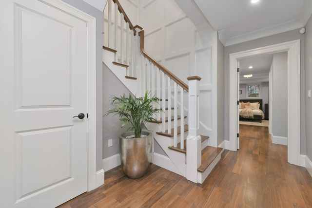 a view of entryway with wooden floor and a potted plant